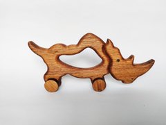 Дерев'яна  іграшка на колесах Носоріг